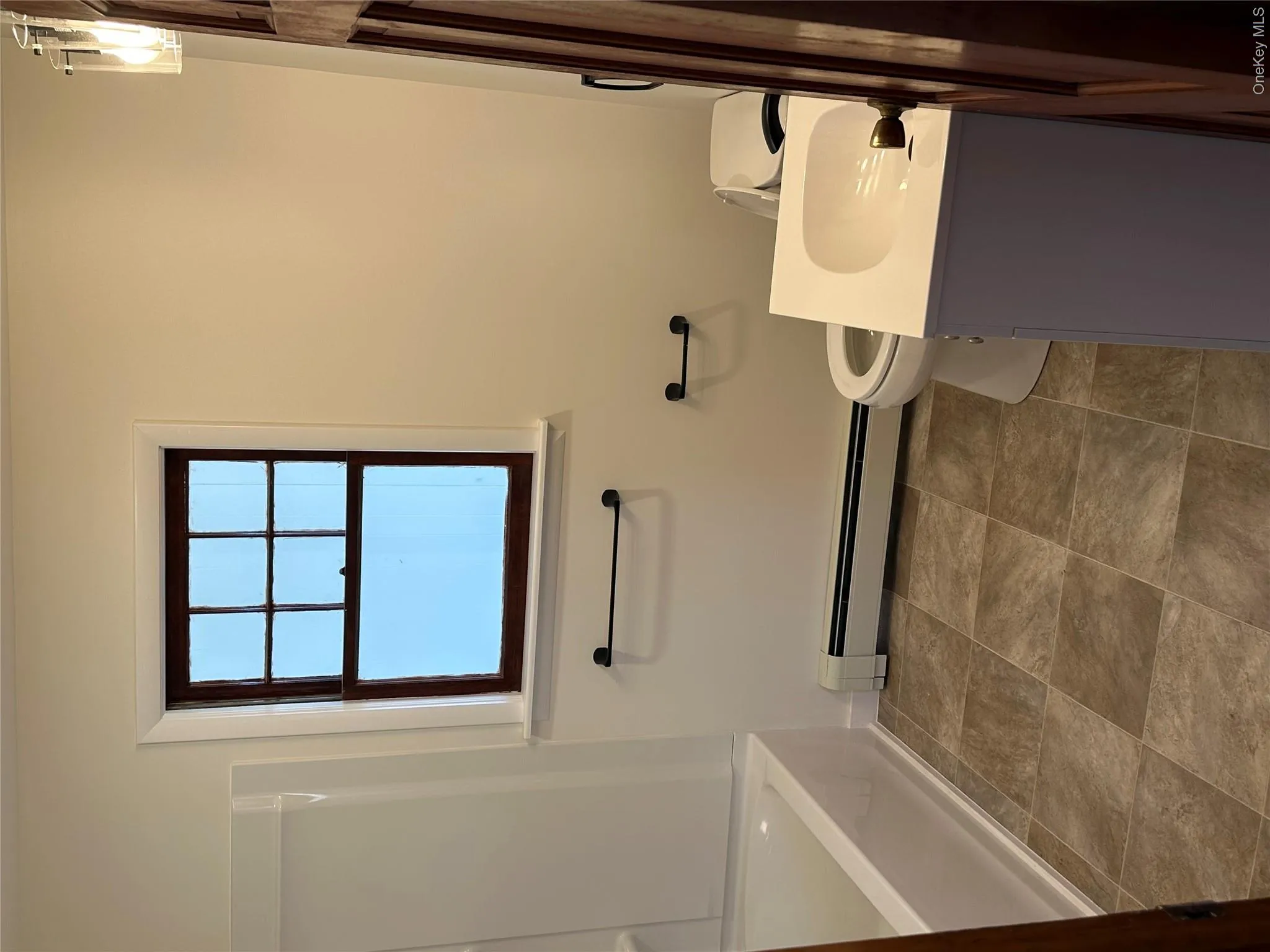 Updated clean bathroom with a full tub and shower on the first floor Updated clean bathroom with a full tub and shower on the first floor