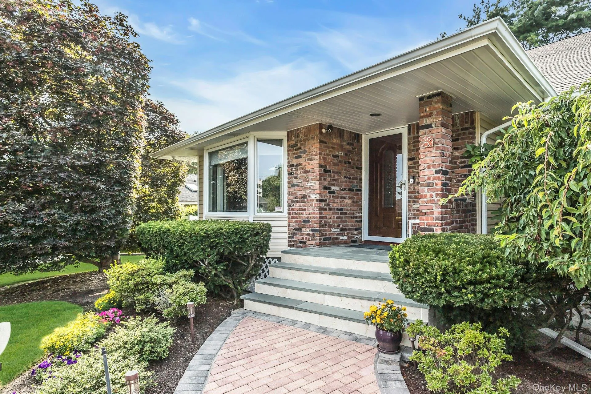 Entrance to property featuring brick siding Entrance to property featuring brick siding