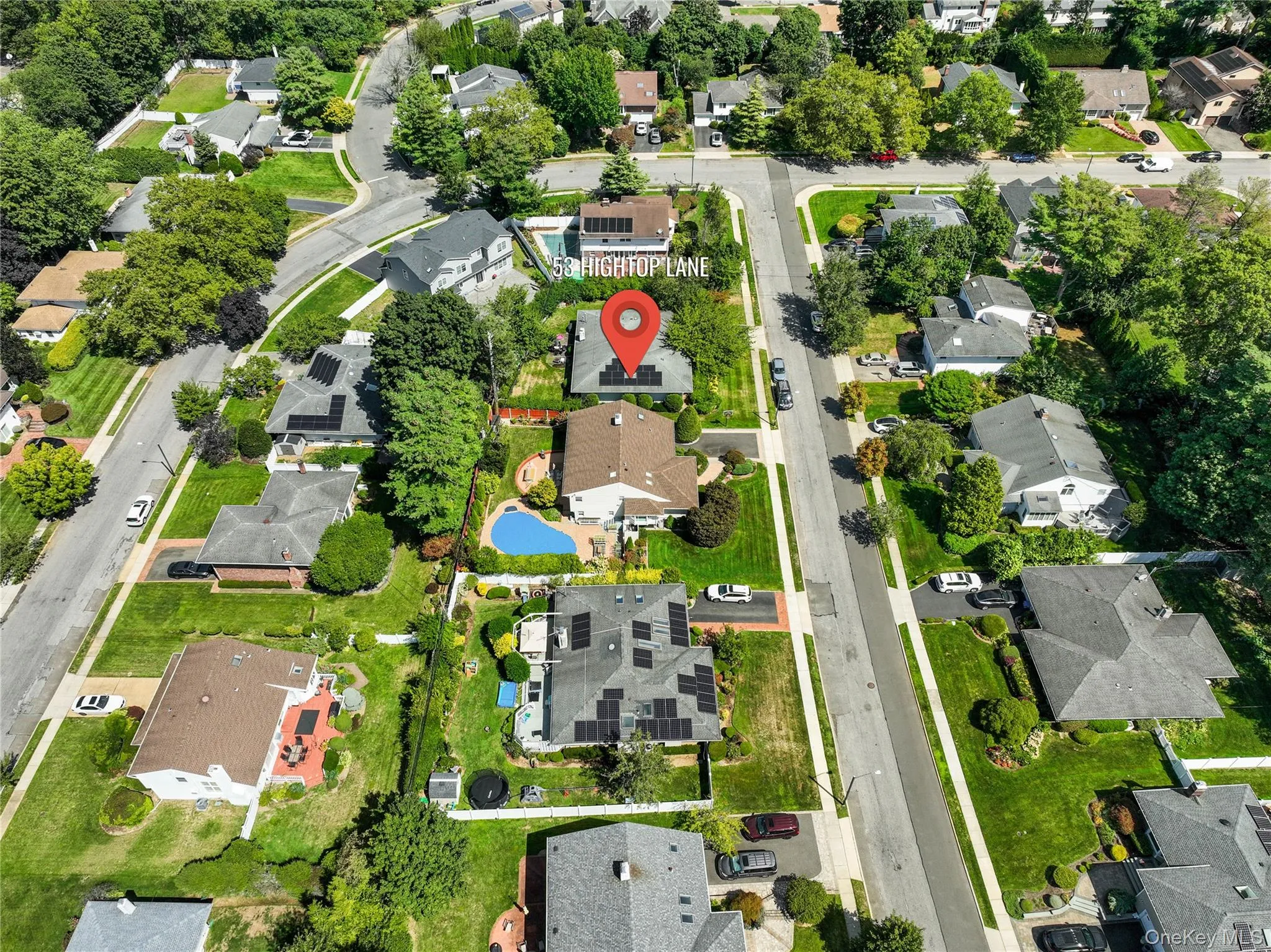 Aerial view of property and surrounding area featuring nearby suburban area Aerial view of property and surrounding area featuring nearby suburban area