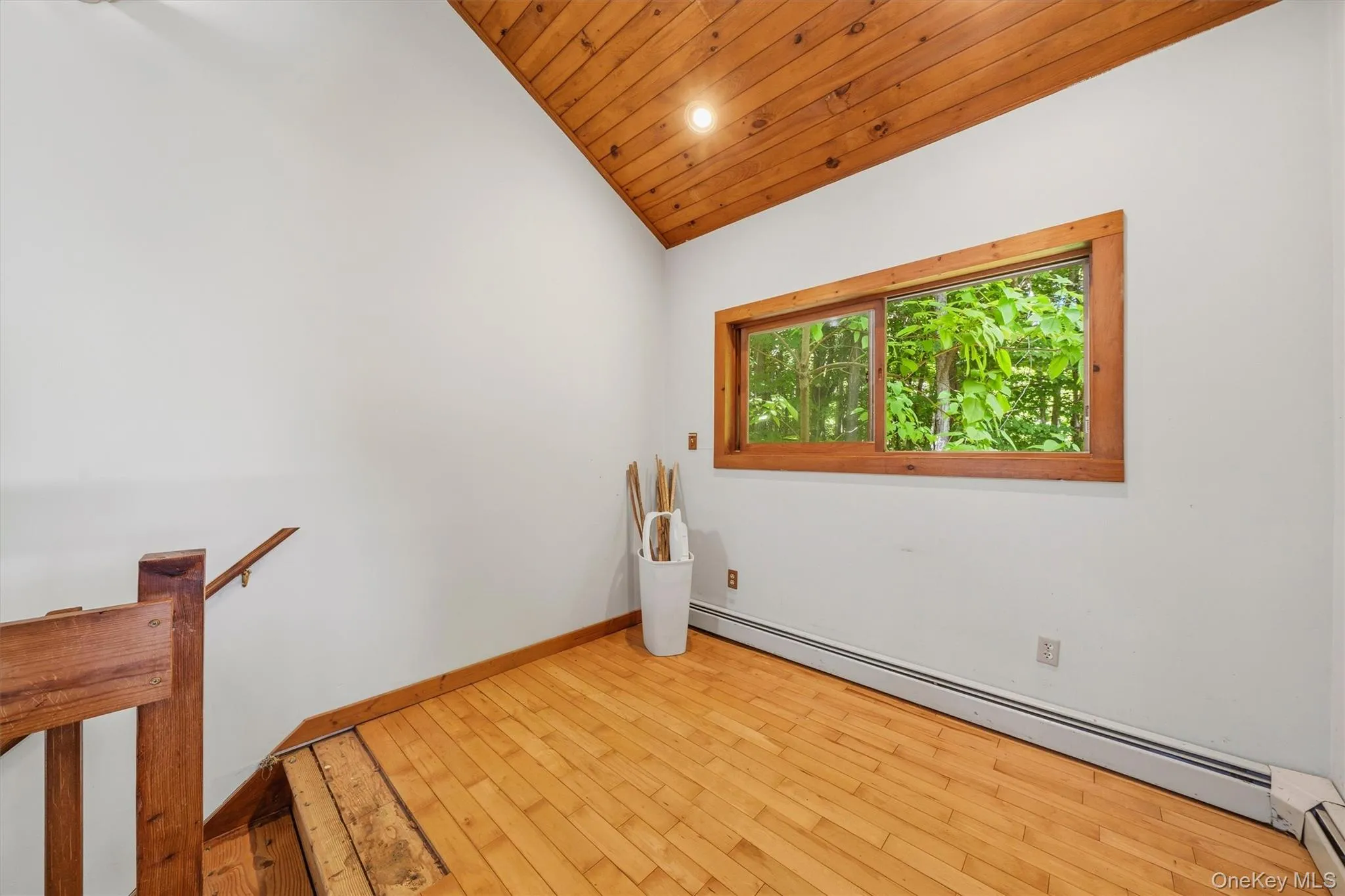 Vaulted wood-paneled ceiling with recessed lighting Vaulted wood-paneled ceiling with recessed lighting