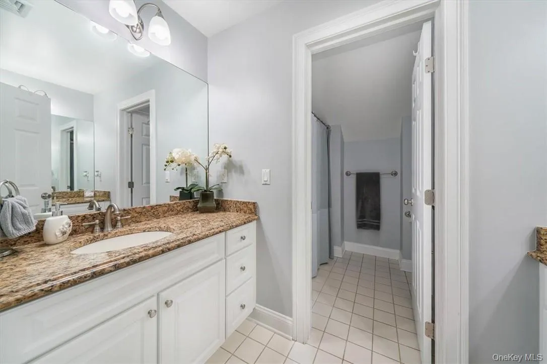 Bathroom with tile flooring and vanity Bathroom with tile flooring and vanity