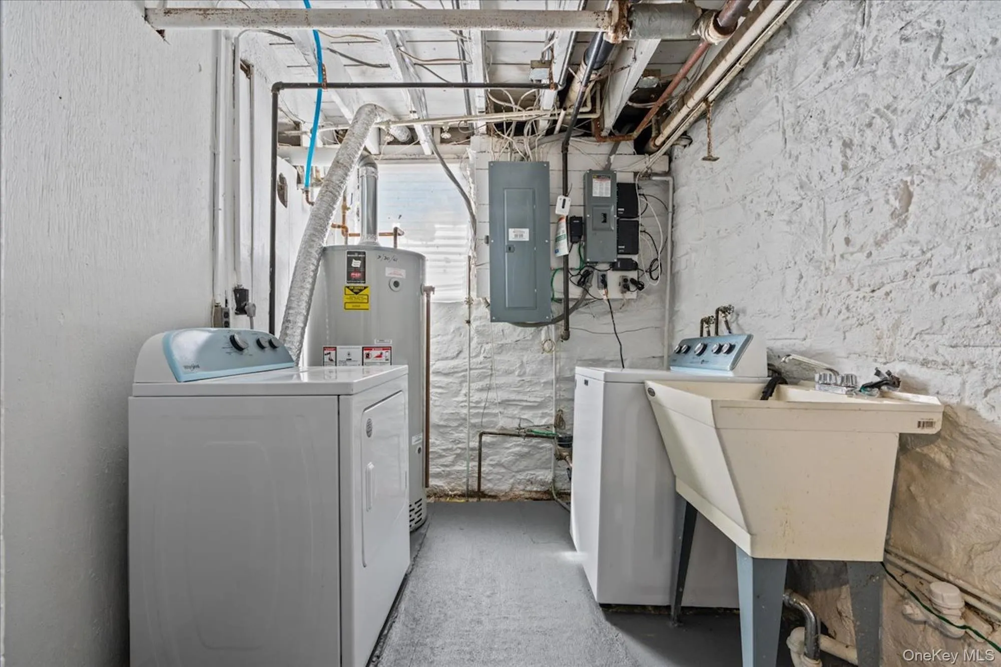 Unfinished basement storage and laundry room Unfinished basement storage and laundry room