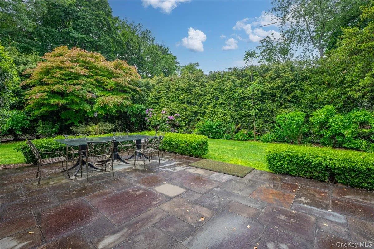 View of the stone expansive stone patio and property View of the stone expansive stone patio and property