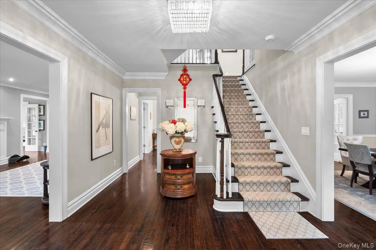 Additional view of the entrance hall highlights the classic center hall layout. Additional view of the entrance hall highlights the classic center hall layout.