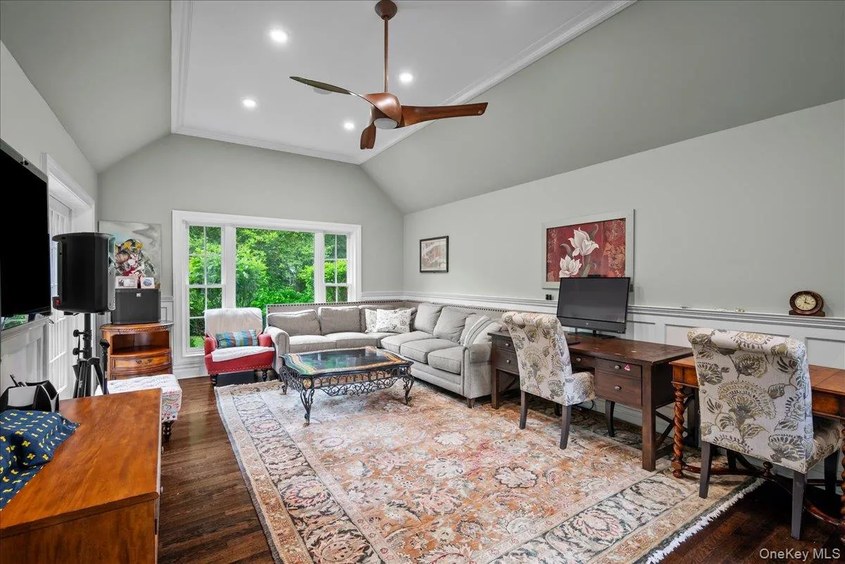 View of the show-stopping family room with vaulted tray ceiling. View of the show-stopping family room with vaulted tray ceiling.