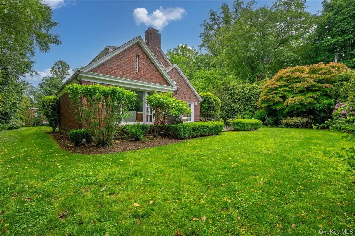 The level property surrounds the classic red brick colonial. The level property surrounds the classic red brick colonial.