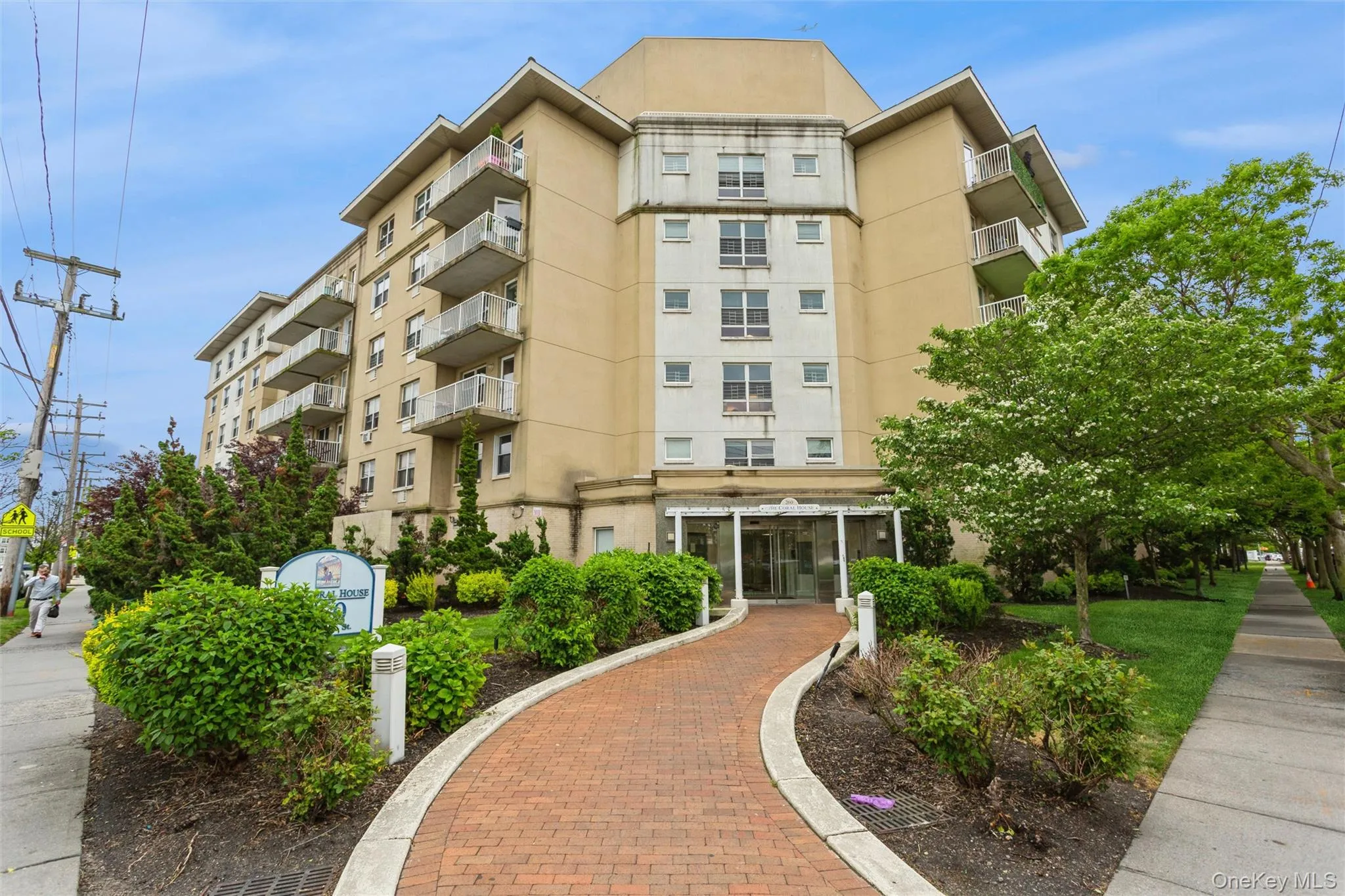 Well-maintained condominium building featuring attractive landscaping, a welcoming entrance, and excellent curb appeal. Well-maintained condominium building featuring attractive landscaping, a welcoming entrance, and excellent curb appeal.