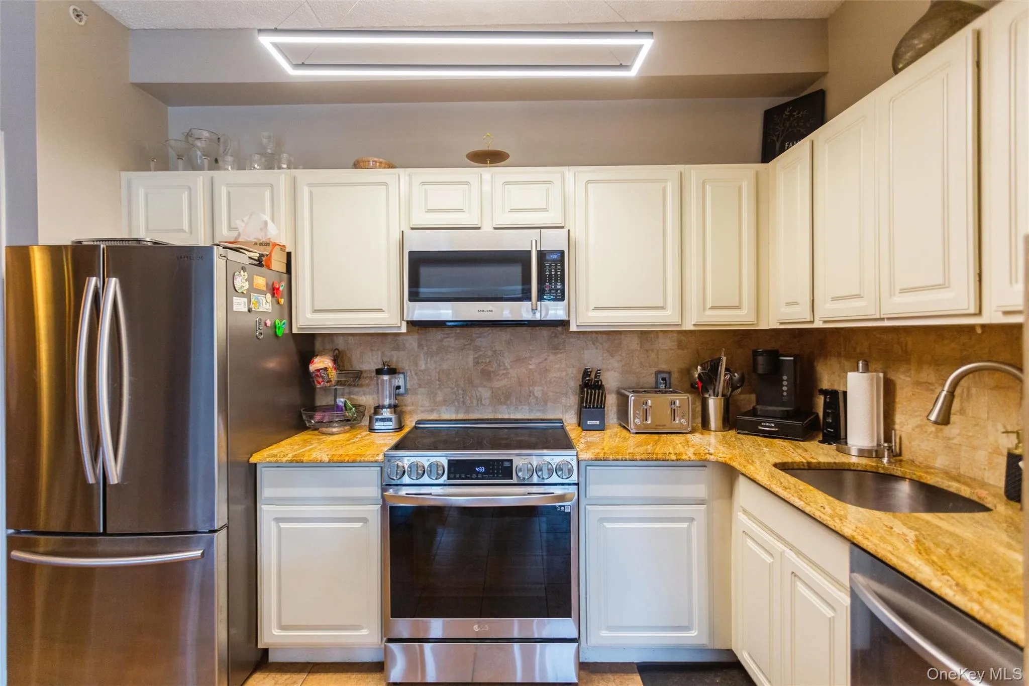 Well-appointed kitchen with modern finishes, abundant storage, and efficient workspace design. Well-appointed kitchen with modern finishes, abundant storage, and efficient workspace design.