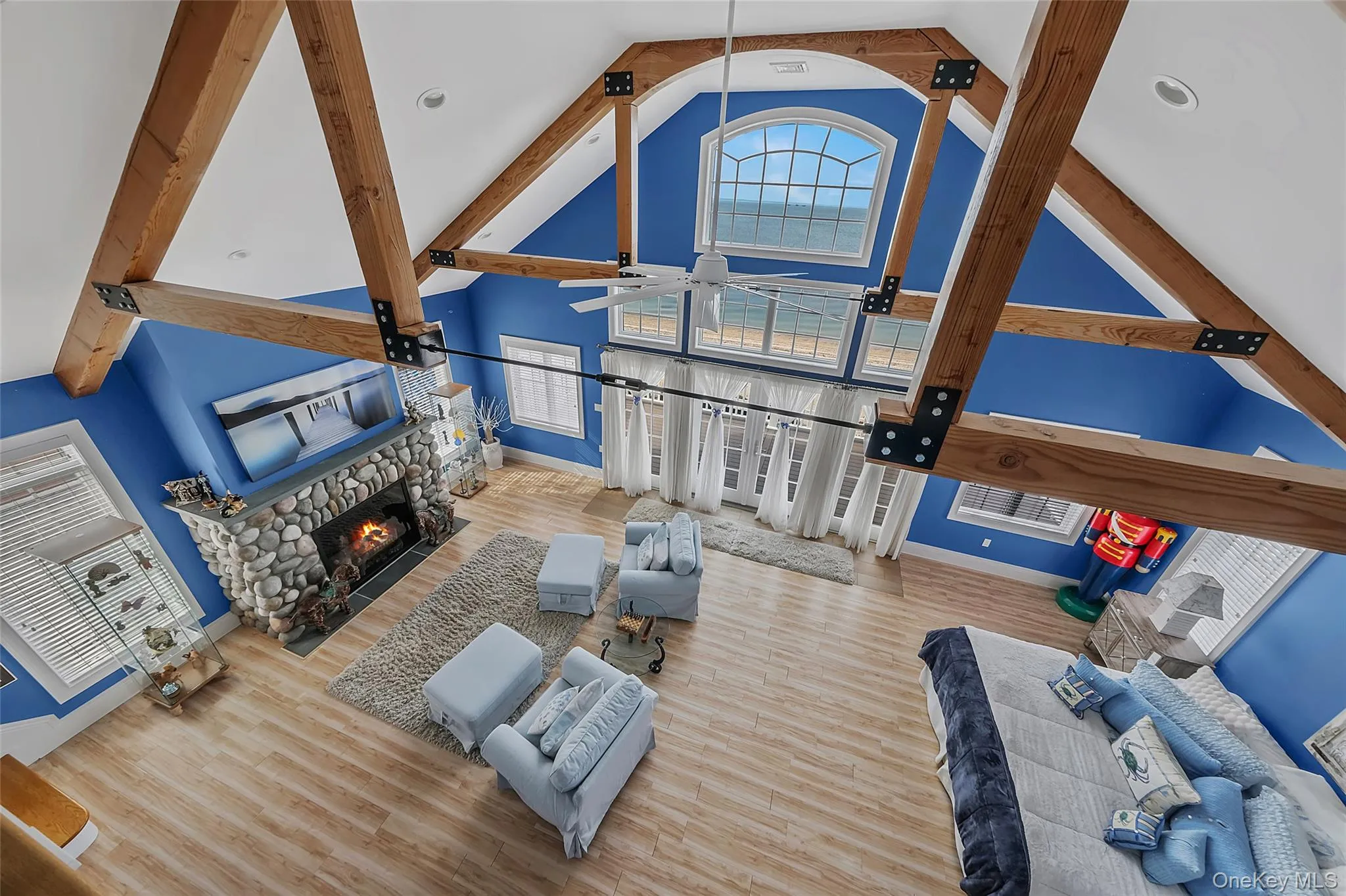 Vaulted ceiling with exposed wood beams and architectural window Vaulted ceiling with exposed wood beams and architectural window