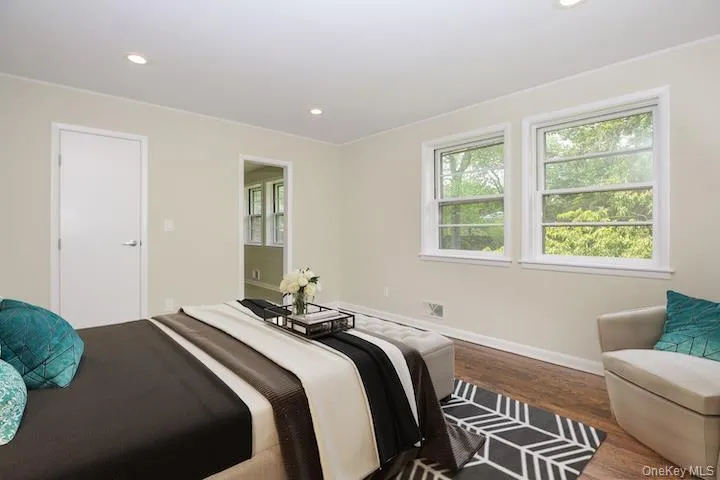 Virtually staged, door to walk-in closet, pocket door to ensuite bathroom Virtually staged, door to walk-in closet, pocket door to ensuite bathroom