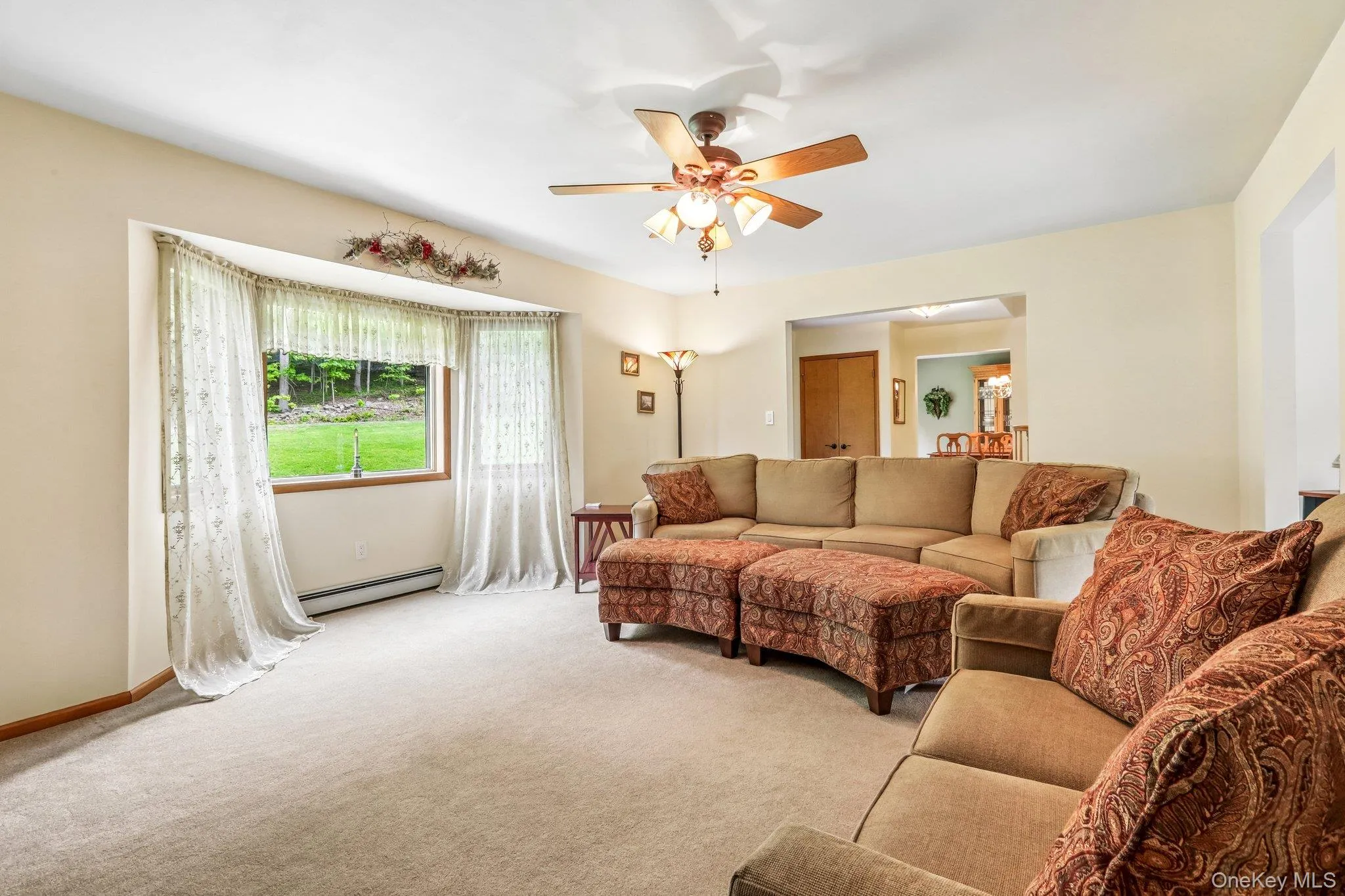 Formal living room with large window. Formal living room with large window.