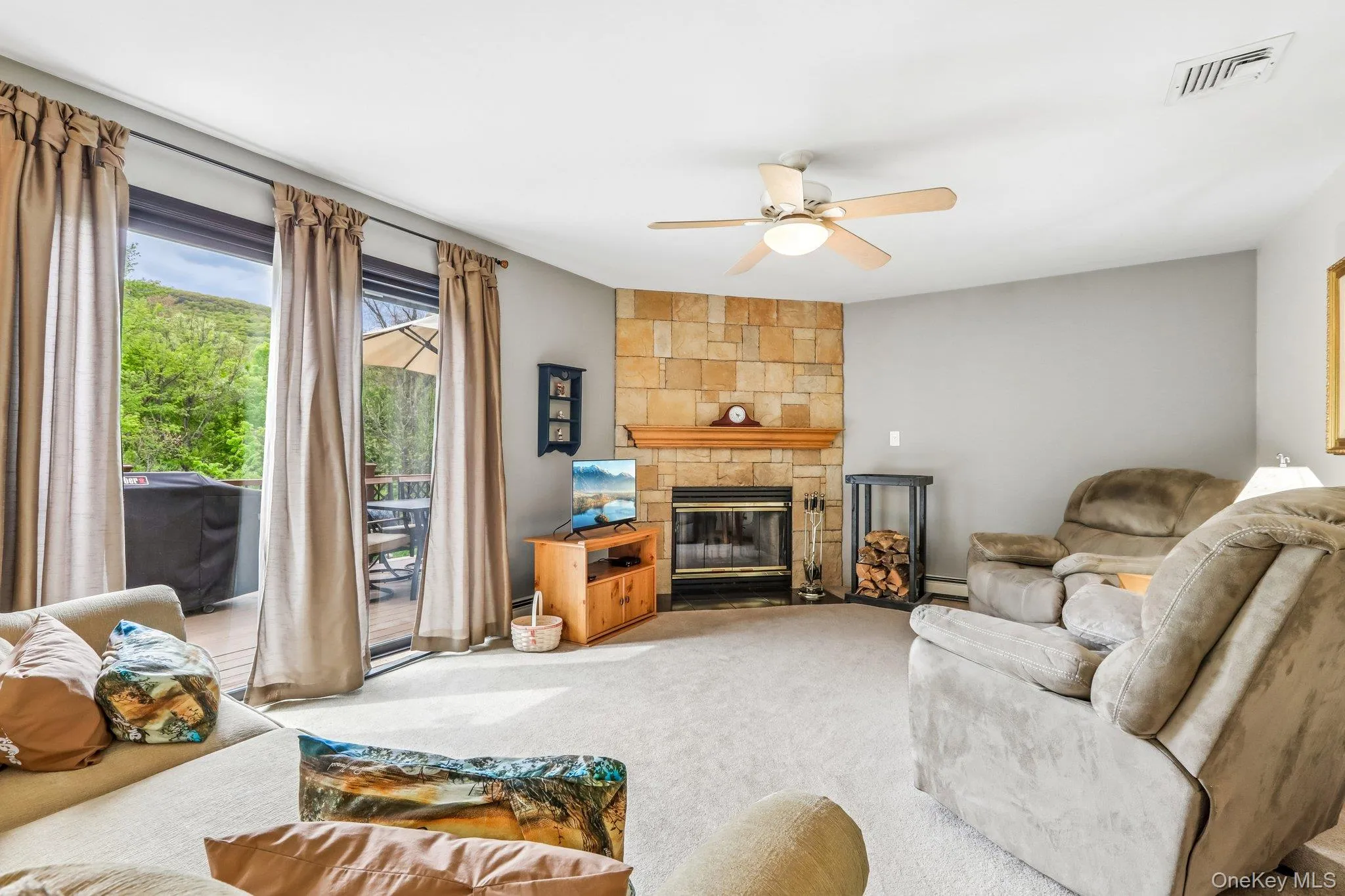 Family room with wood burning fireplace. Family room with wood burning fireplace.
