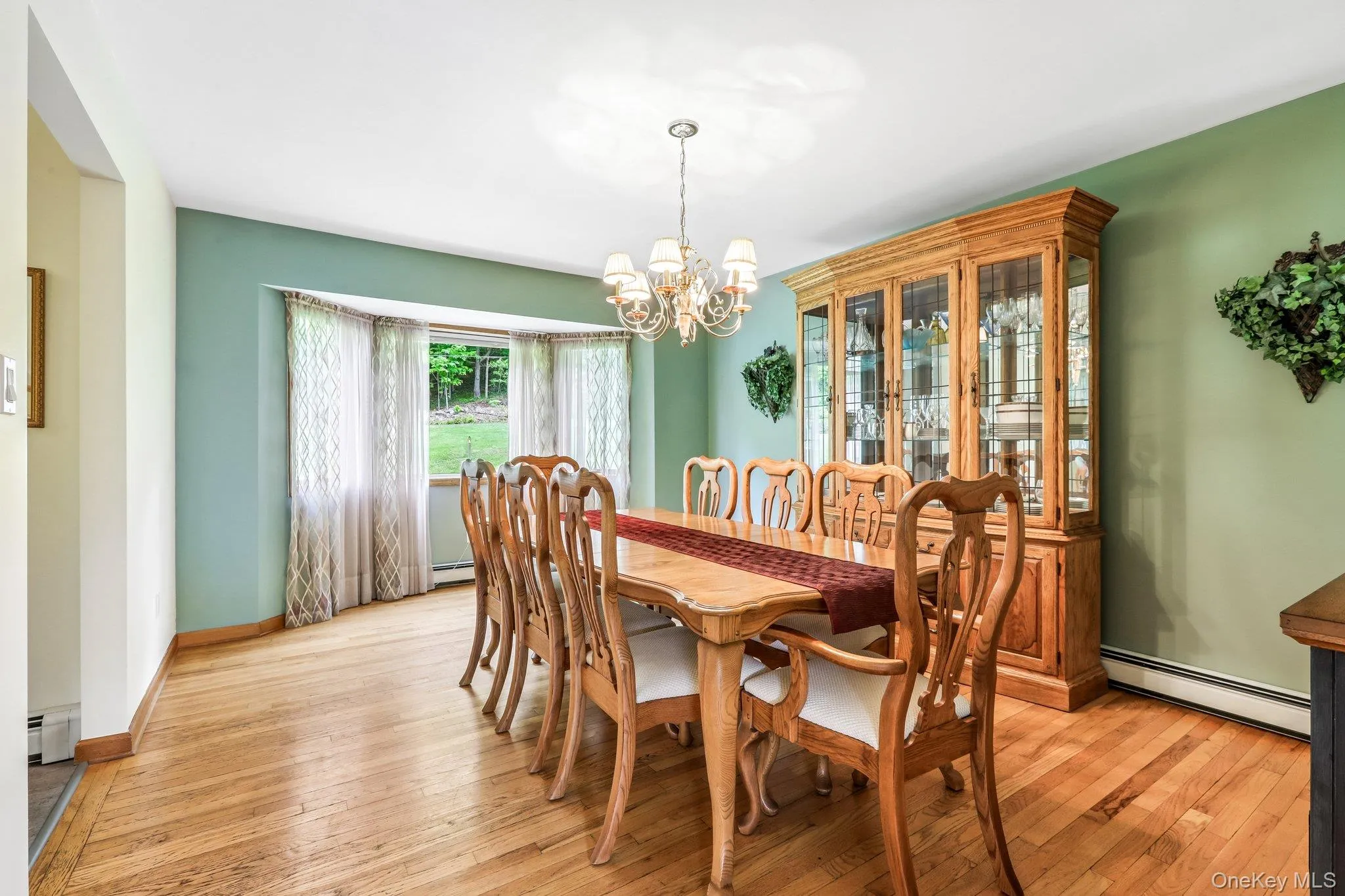 Dining room has hardwood flooring. Dining room has hardwood flooring.