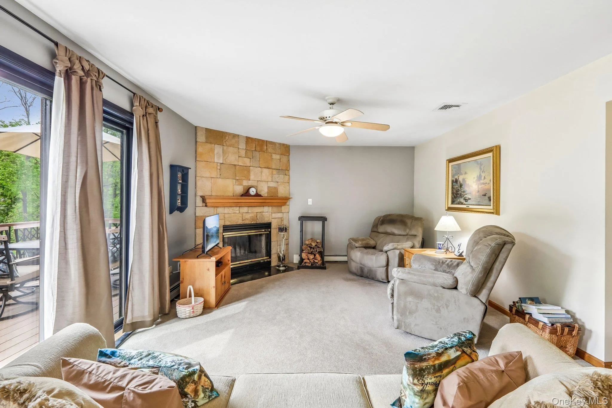 Family room has sliders leading to the deck. Family room has sliders leading to the deck.