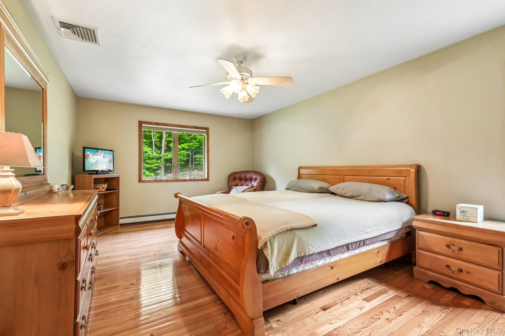 Primary bedroom has hardwood floors. Primary bedroom has hardwood floors.