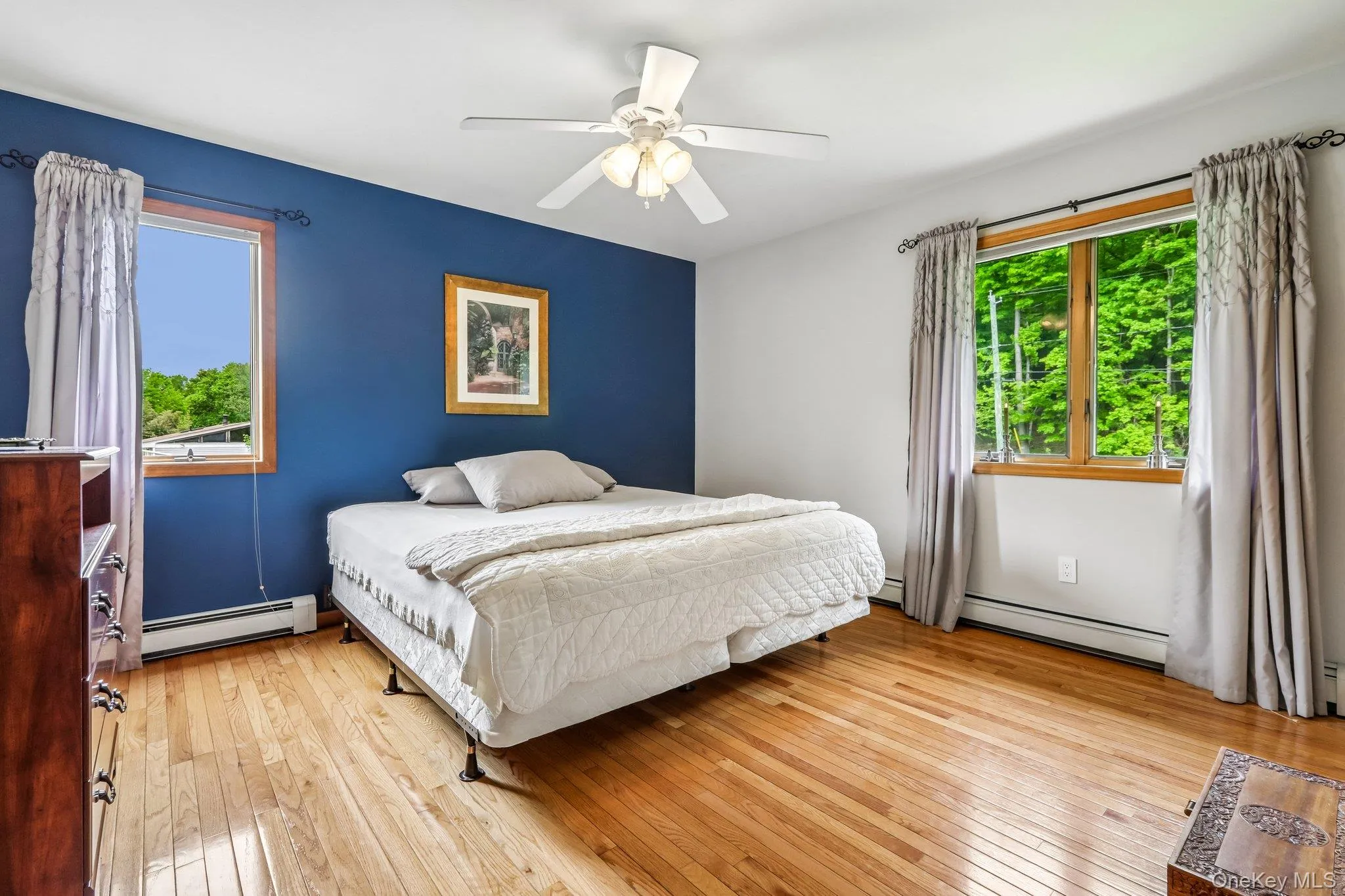 Large bedroom with hardwood floors. Large bedroom with hardwood floors.