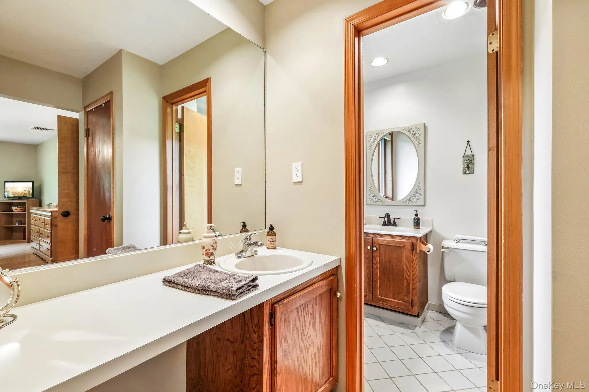 Primary bathroom with dual split sinks and stall shower. Primary bathroom with dual split sinks and stall shower.