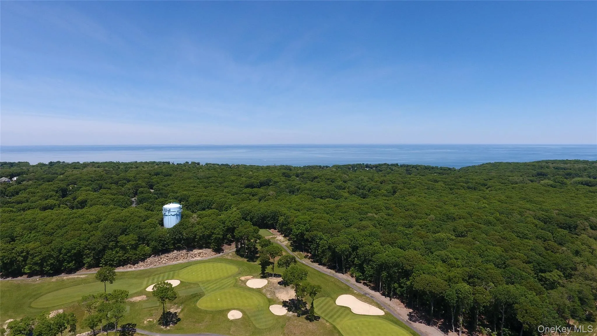 Aerial View of Golf Course behind the House Aerial View of Golf Course behind the House