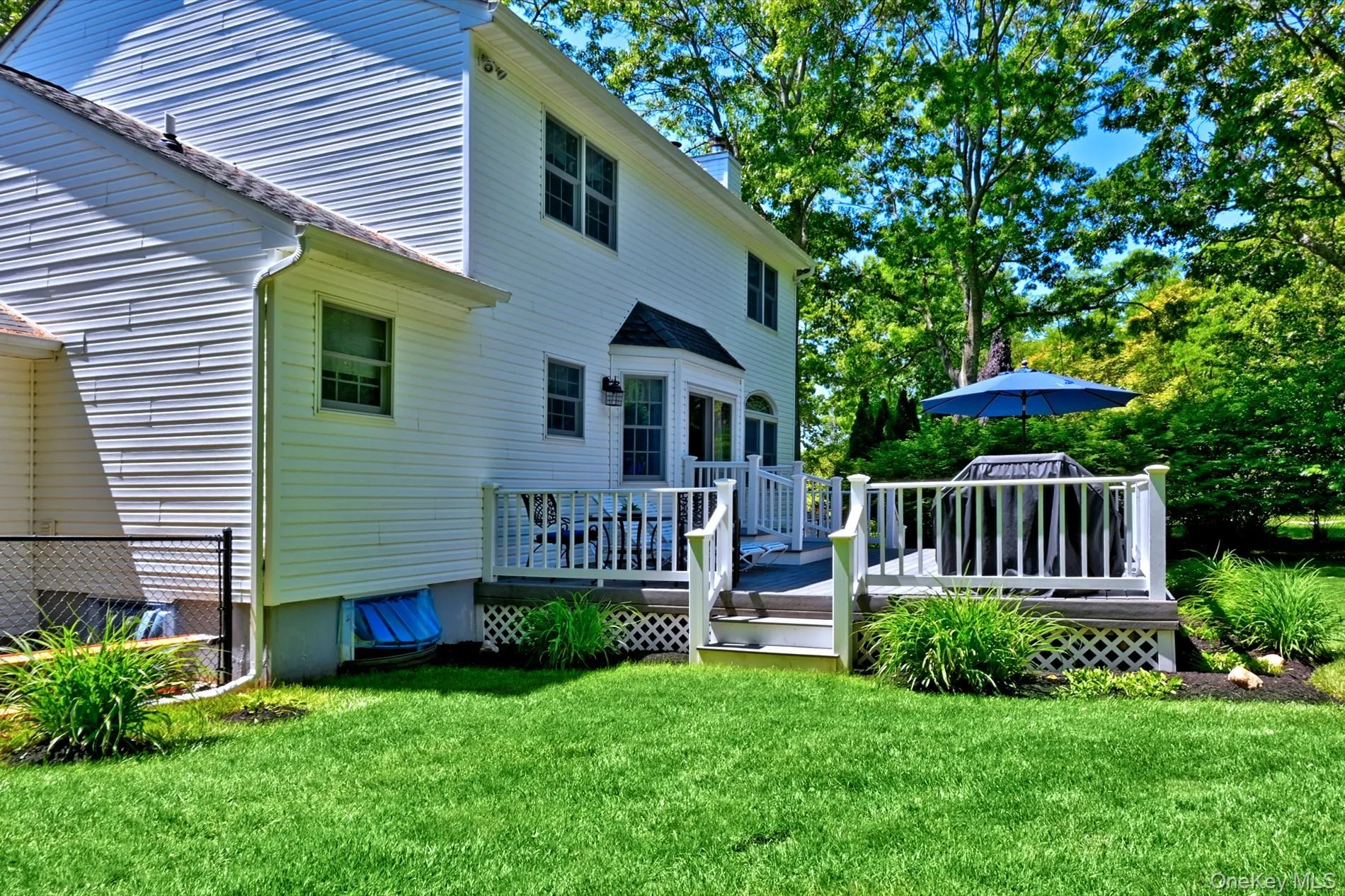 Spacious Deck built with Easy Maintenance Composite Material. Fenced Yard Spacious Deck built with Easy Maintenance Composite Material. Fenced Yard
