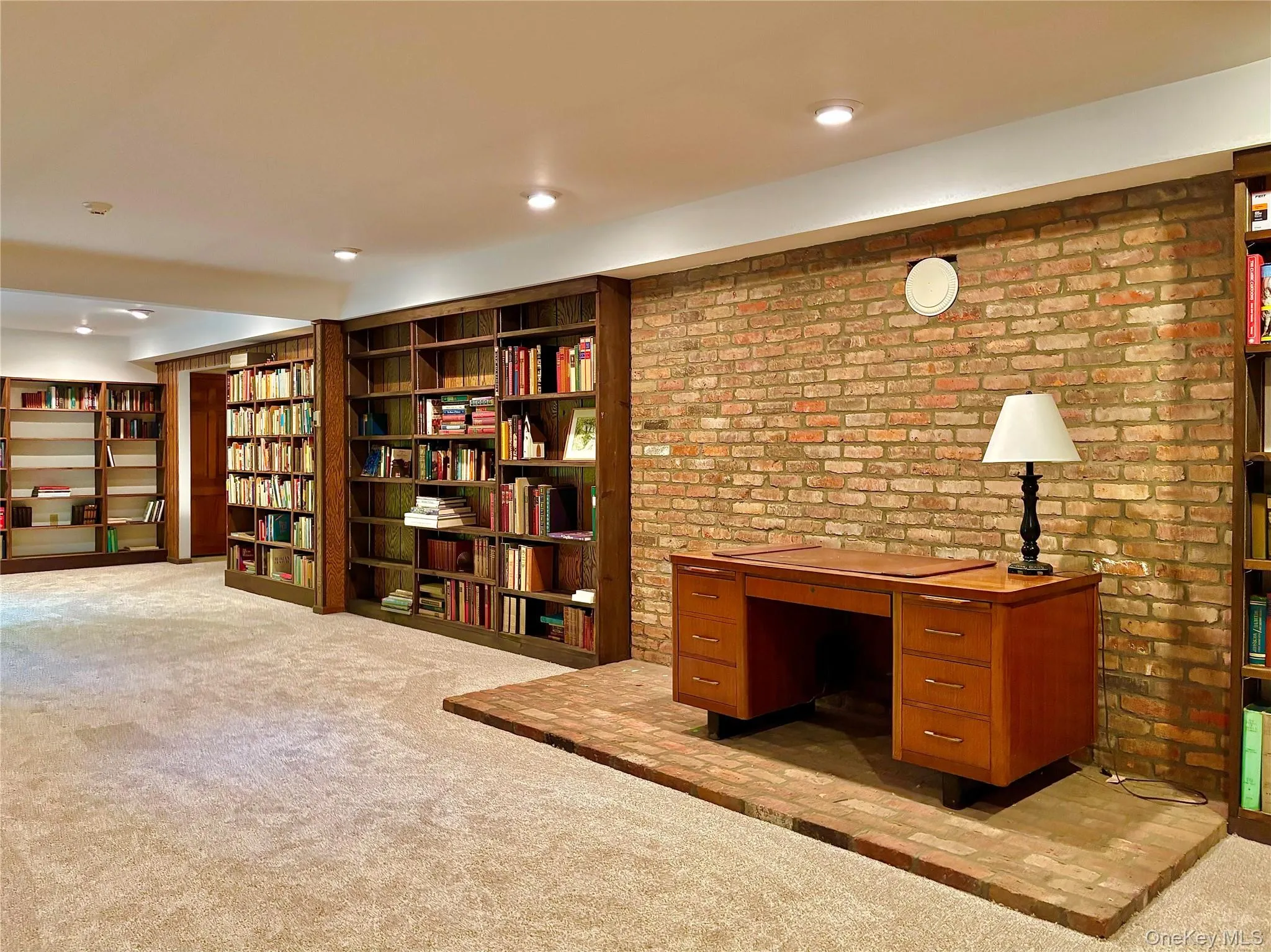 Library, office/study with walk-out doors to yard. Library, office/study with walk-out doors to yard.