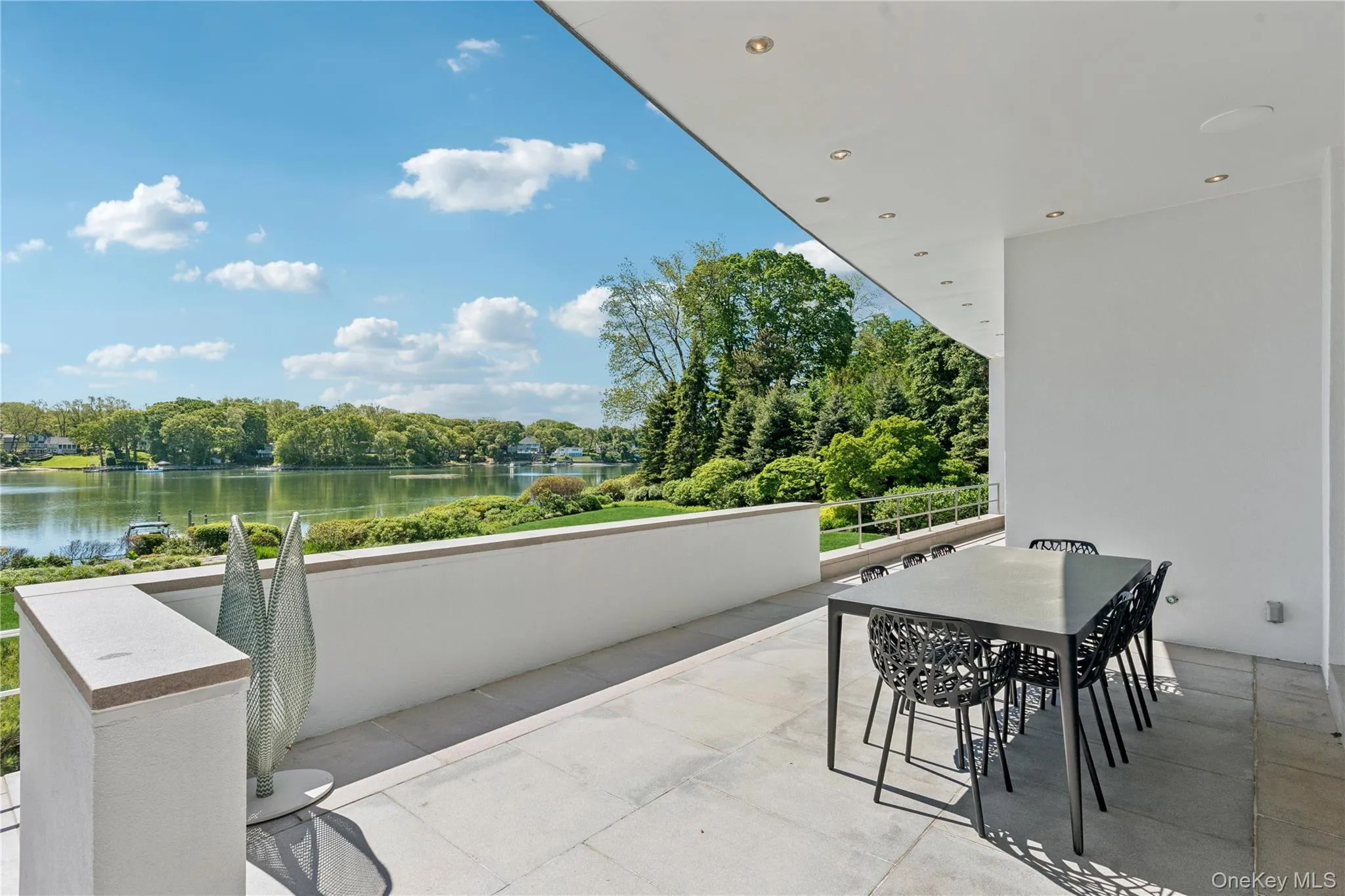 Outdoor Dining Space Overlooking the Water Outdoor Dining Space Overlooking the Water