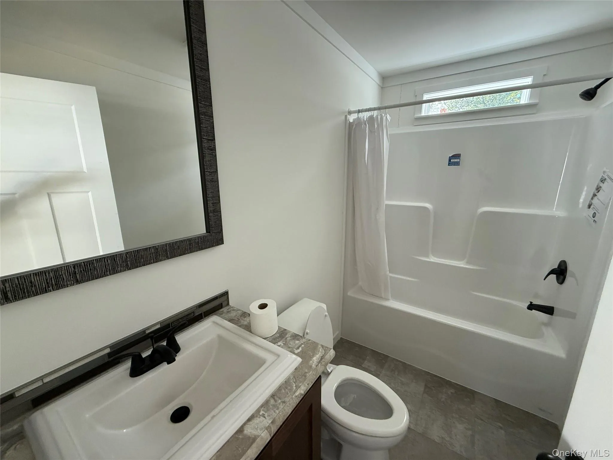Full bath featuring shower / bath combo and vanity Full bath featuring shower / bath combo and vanity