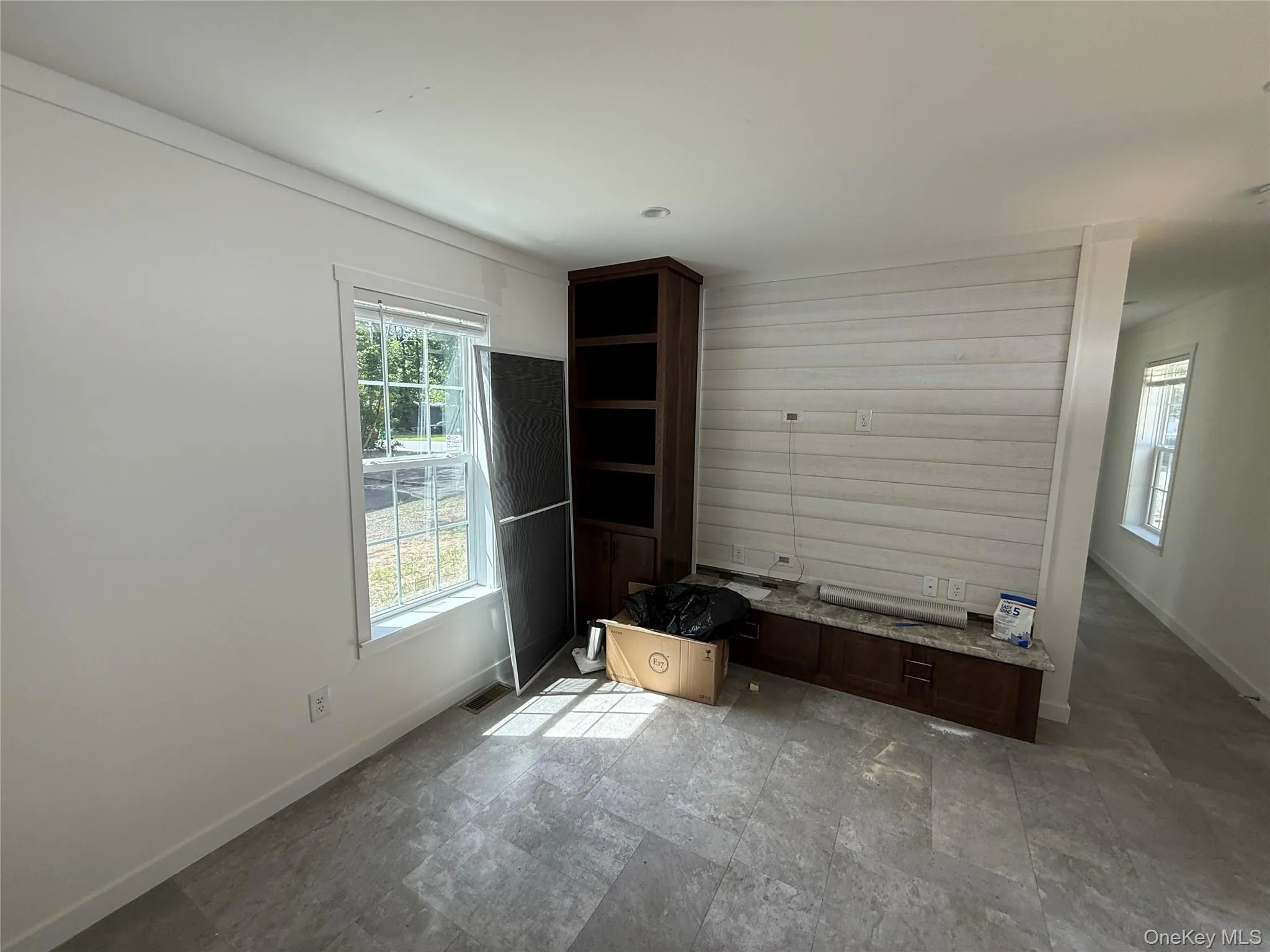 Unfurnished bedroom featuring baseboards and stone finish floors Unfurnished bedroom featuring baseboards and stone finish floors
