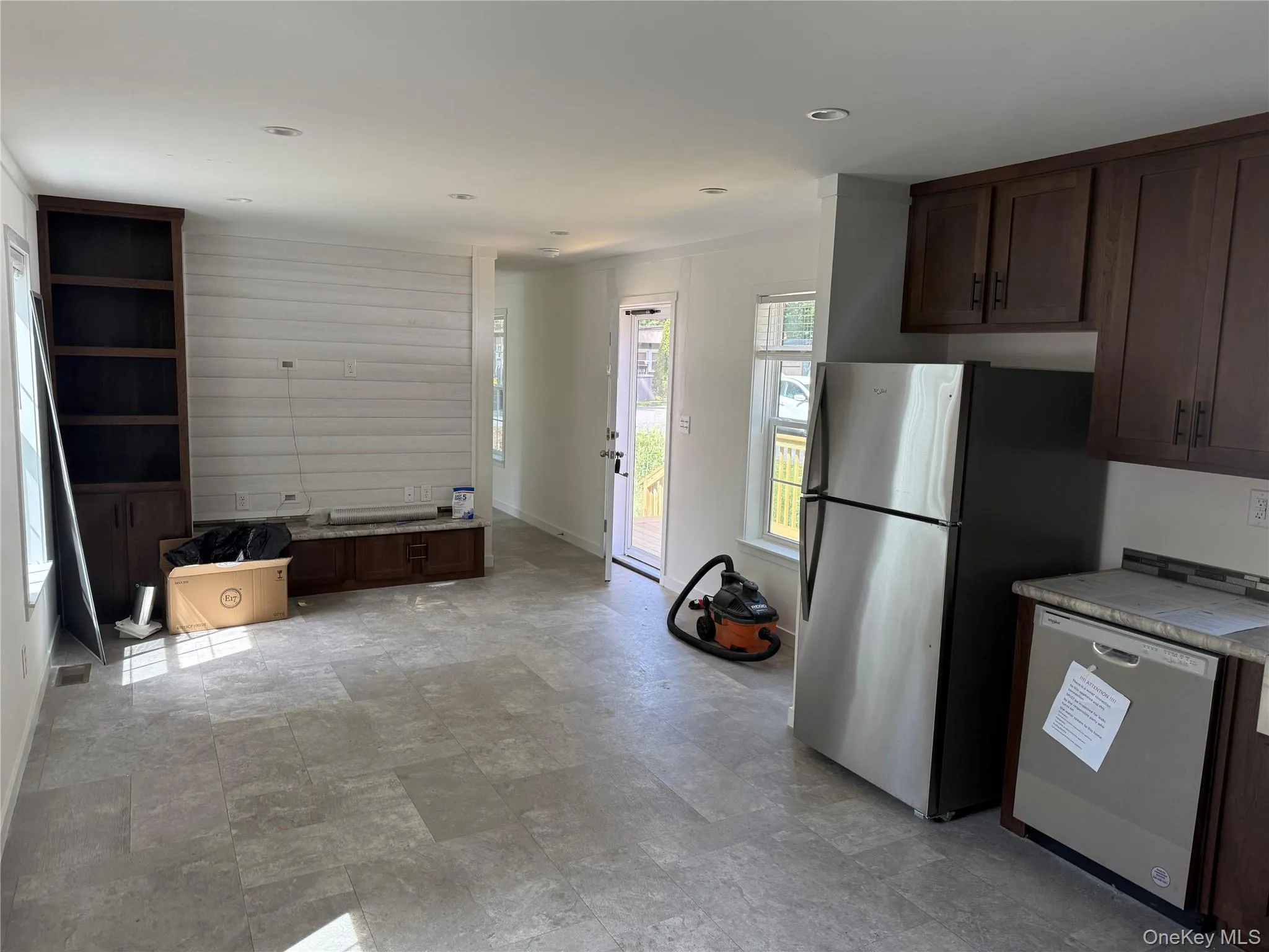 Kitchen featuring dark brown cabinetry, stainless steel appliances, stone finish flooring, and recessed lighting Kitchen featuring dark brown cabinetry, stainless steel appliances, stone finish flooring, and recessed lighting