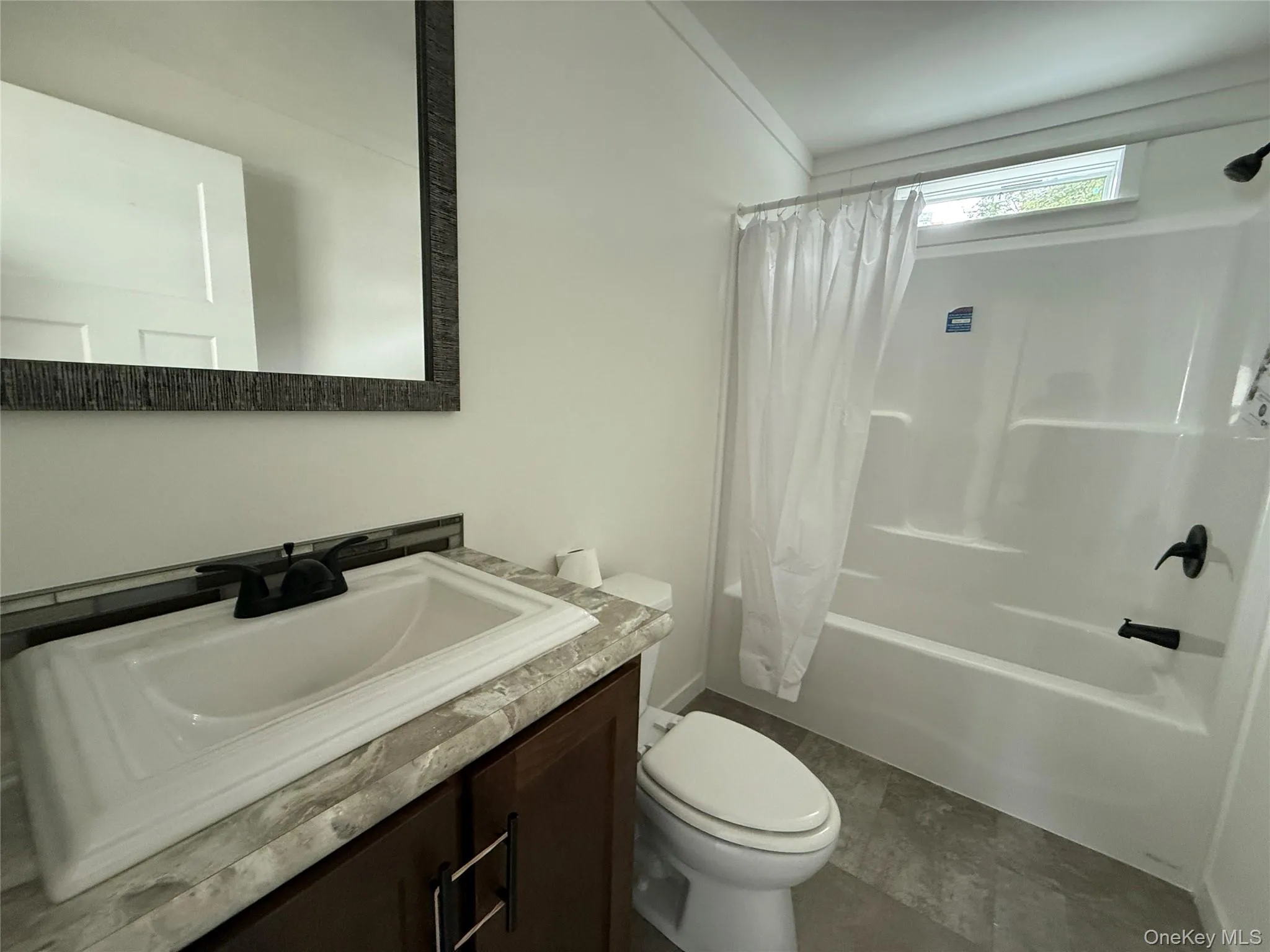 Bathroom with shower / bath combo and vanity Bathroom with shower / bath combo and vanity