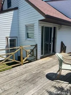 back of house with large deck area for summer fun back of house with large deck area for summer fun