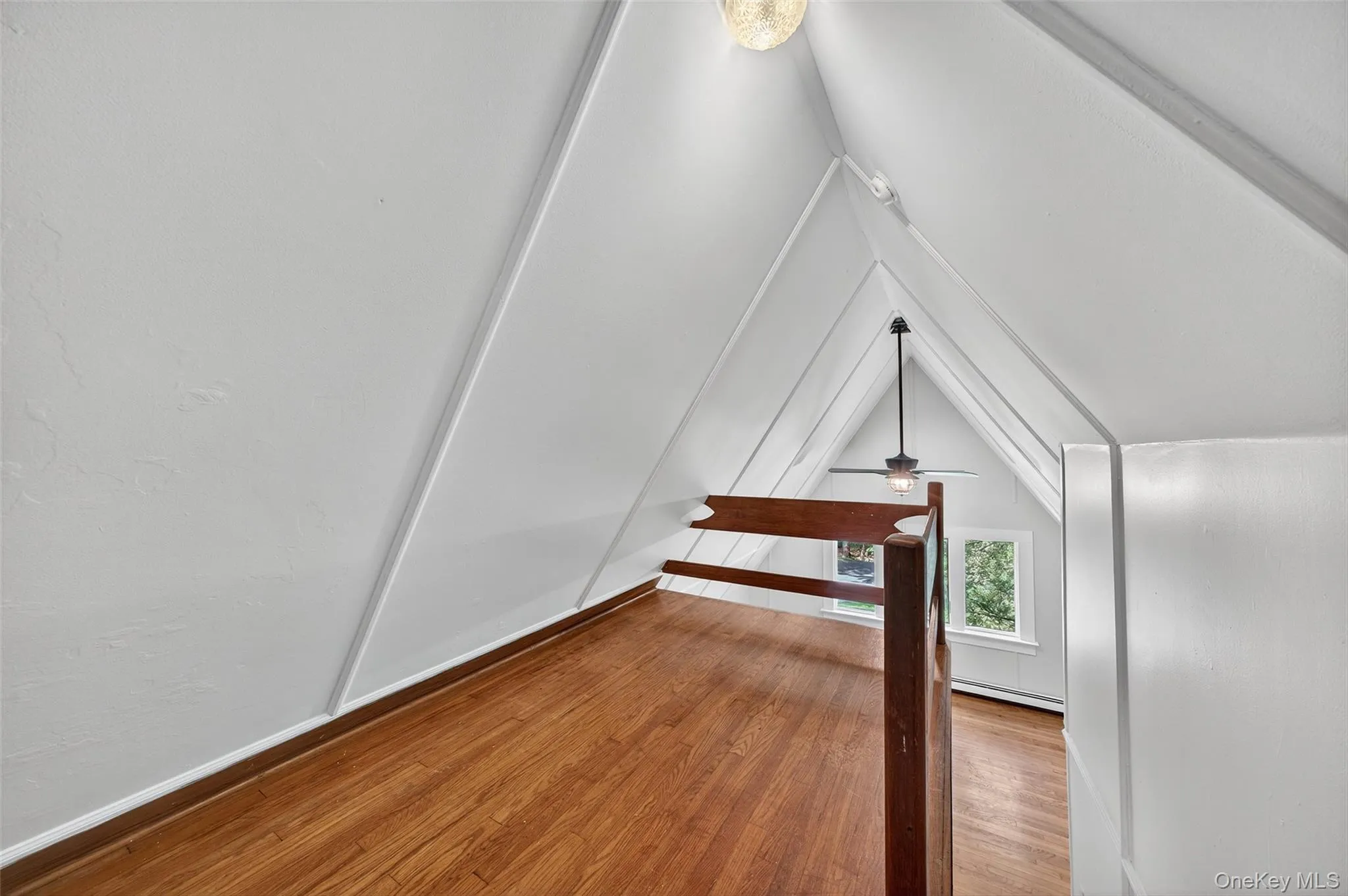 Bonus loft featuring wood floors, and vaulted ceiling. Bonus loft featuring wood floors, and vaulted ceiling.