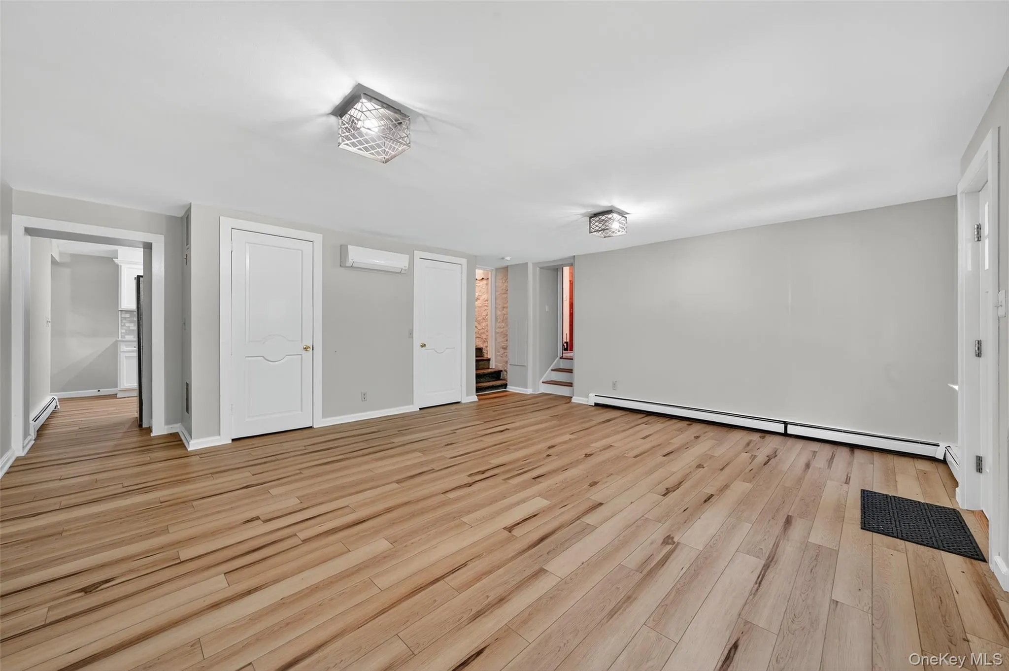 On the far left side of the living room is the entry to the kitchen On the far left side of the living room is the entry to the kitchen