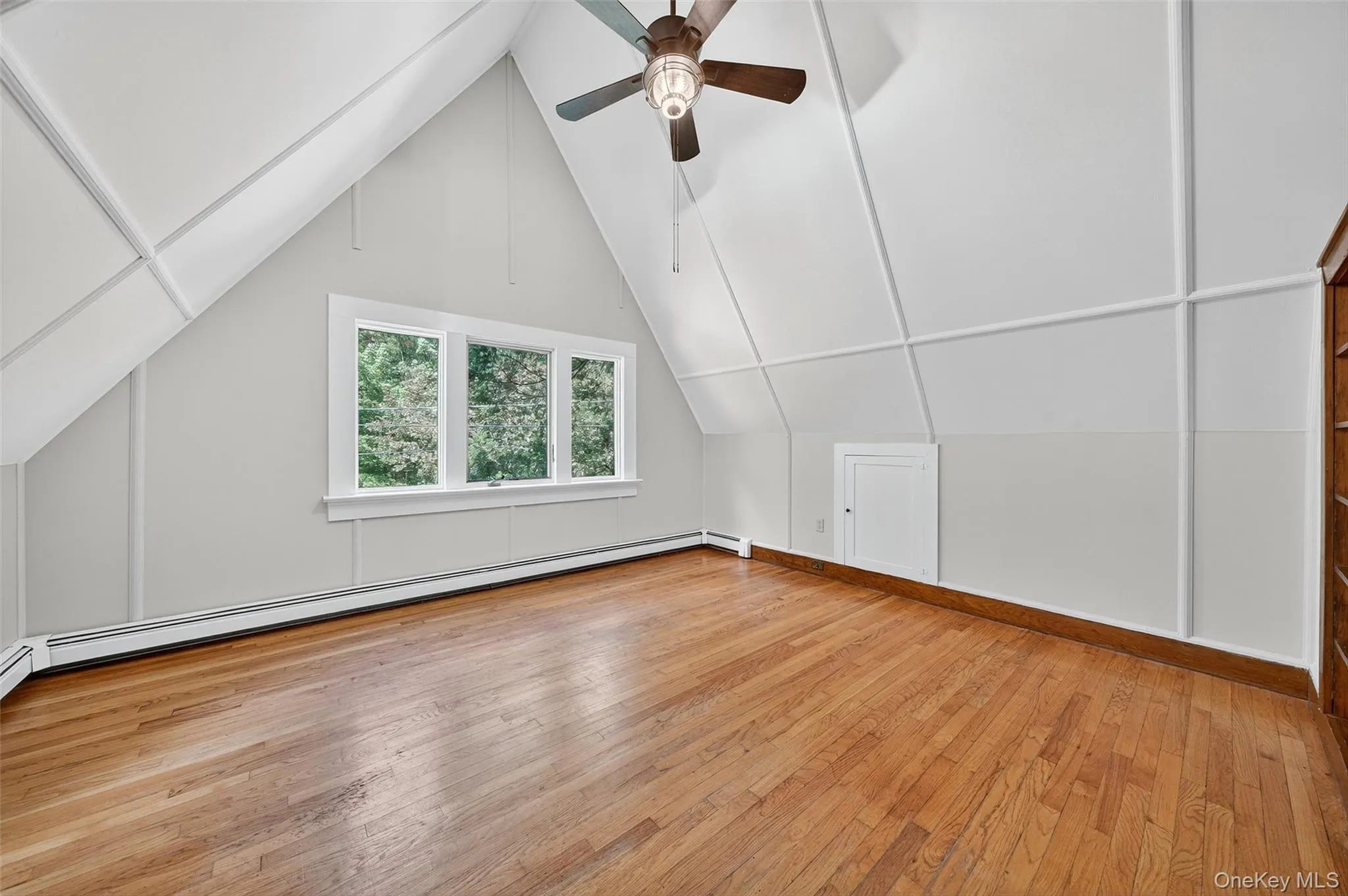 Additional living space with light wood finished floors, and a ceiling fan. Additional living space with light wood finished floors, and a ceiling fan.