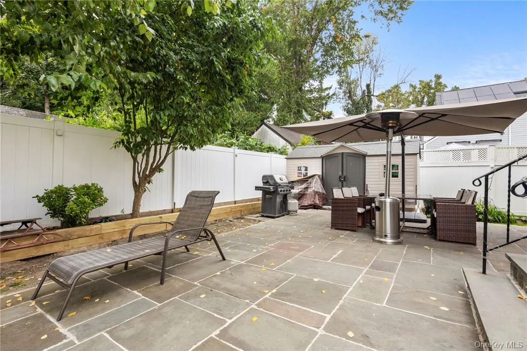 View of patio / terrace with a grill and a storage unit View of patio / terrace with a grill and a storage unit
