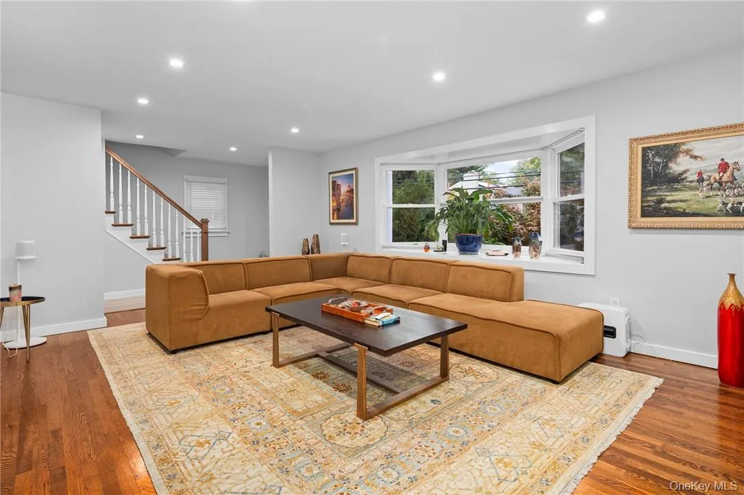 Living room with hardwood / wood-style flooring Living room with hardwood / wood-style flooring
