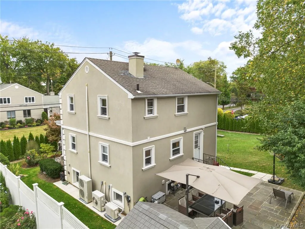 Rear view of property featuring a patio, ac unit, and a yard Rear view of property featuring a patio, ac unit, and a yard