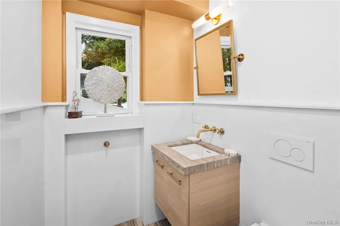 Bathroom with hardwood / wood-style flooring and vanity Bathroom with hardwood / wood-style flooring and vanity