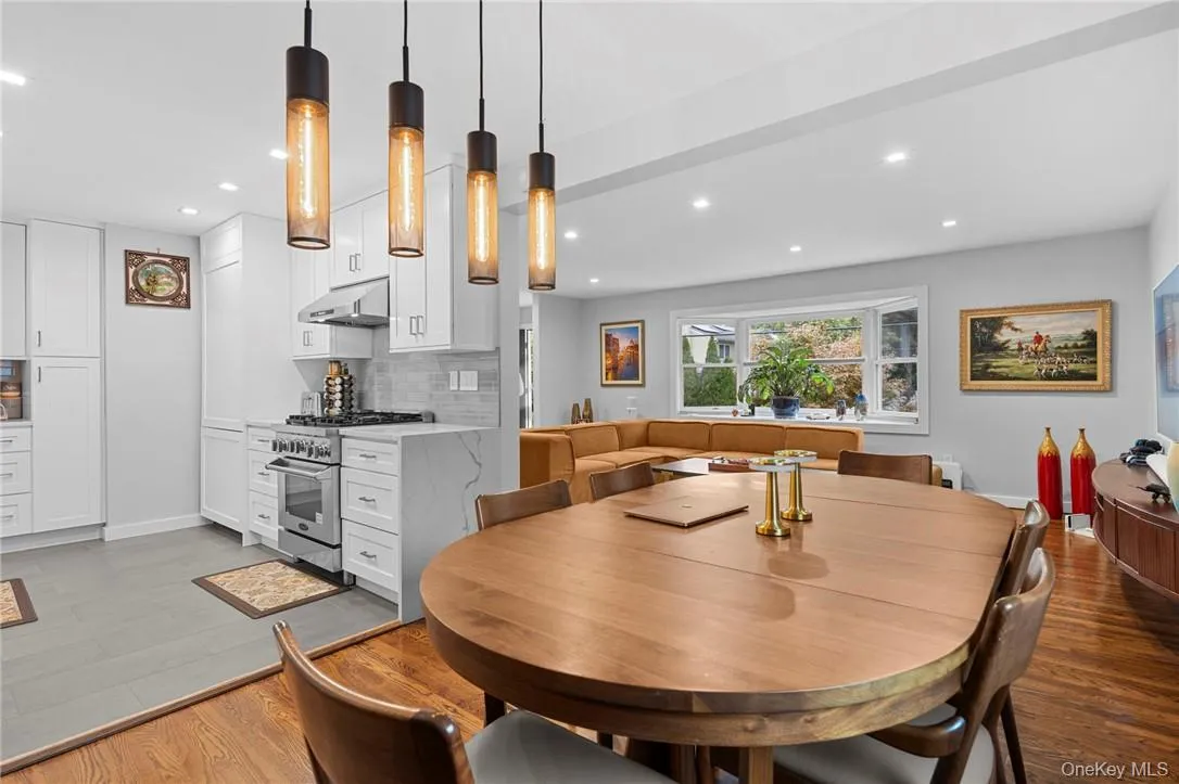 Dining area with light hardwood / wood-style floors Dining area with light hardwood / wood-style floors