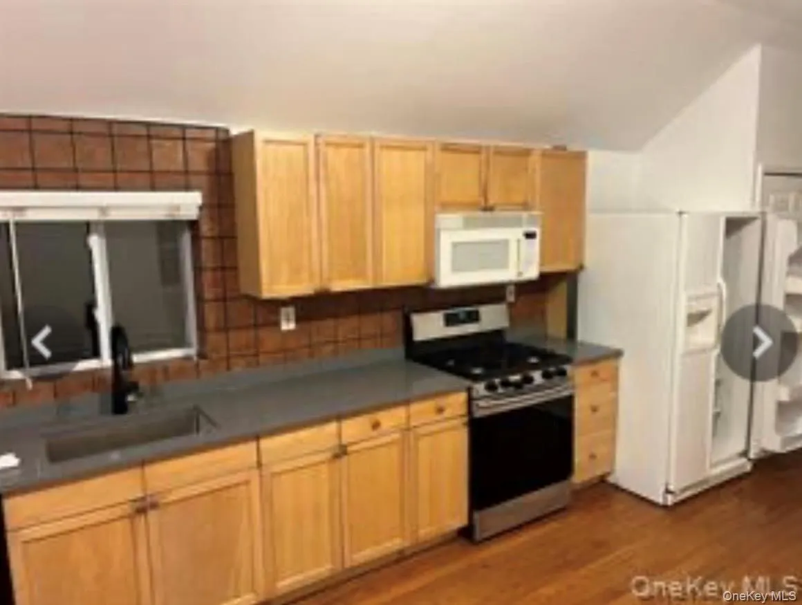 Kitchen with new quartz countertops & dishwasher, side by side fridge. Washer/dryer Kitchen with new quartz countertops & dishwasher, side by side fridge. Washer/dryer