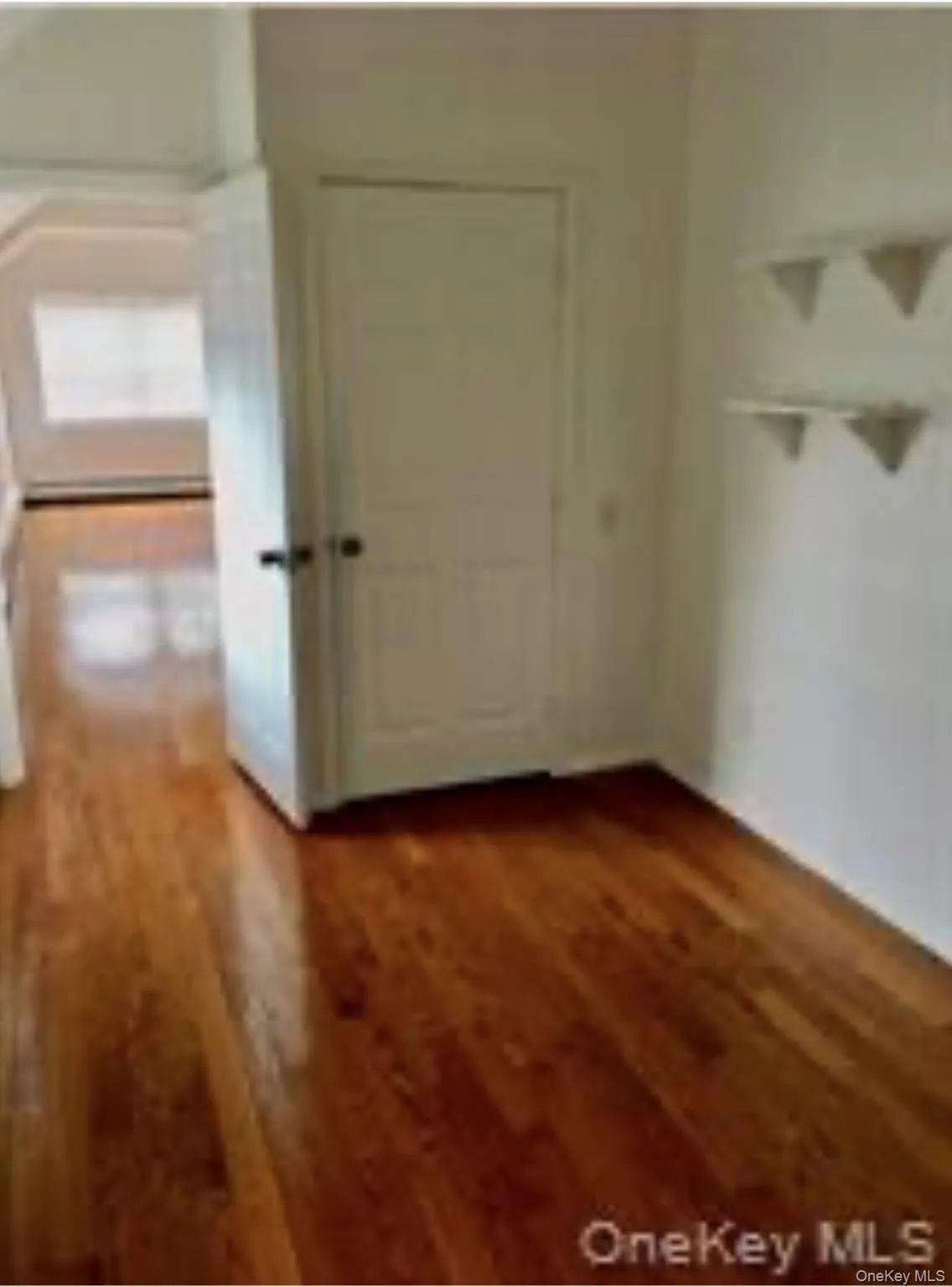 Inside second bedroom looking into living room Inside second bedroom looking into living room