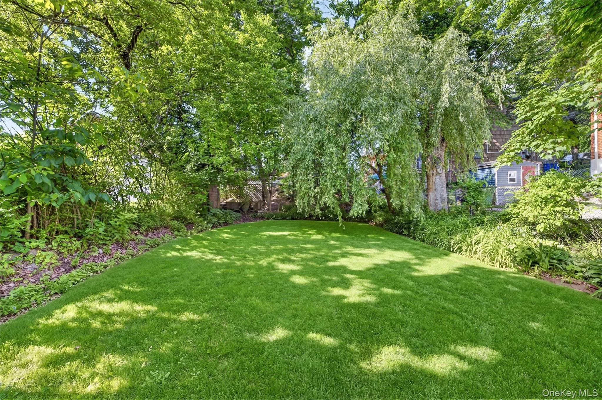 Stunning yard, lush and private. Stunning yard, lush and private.