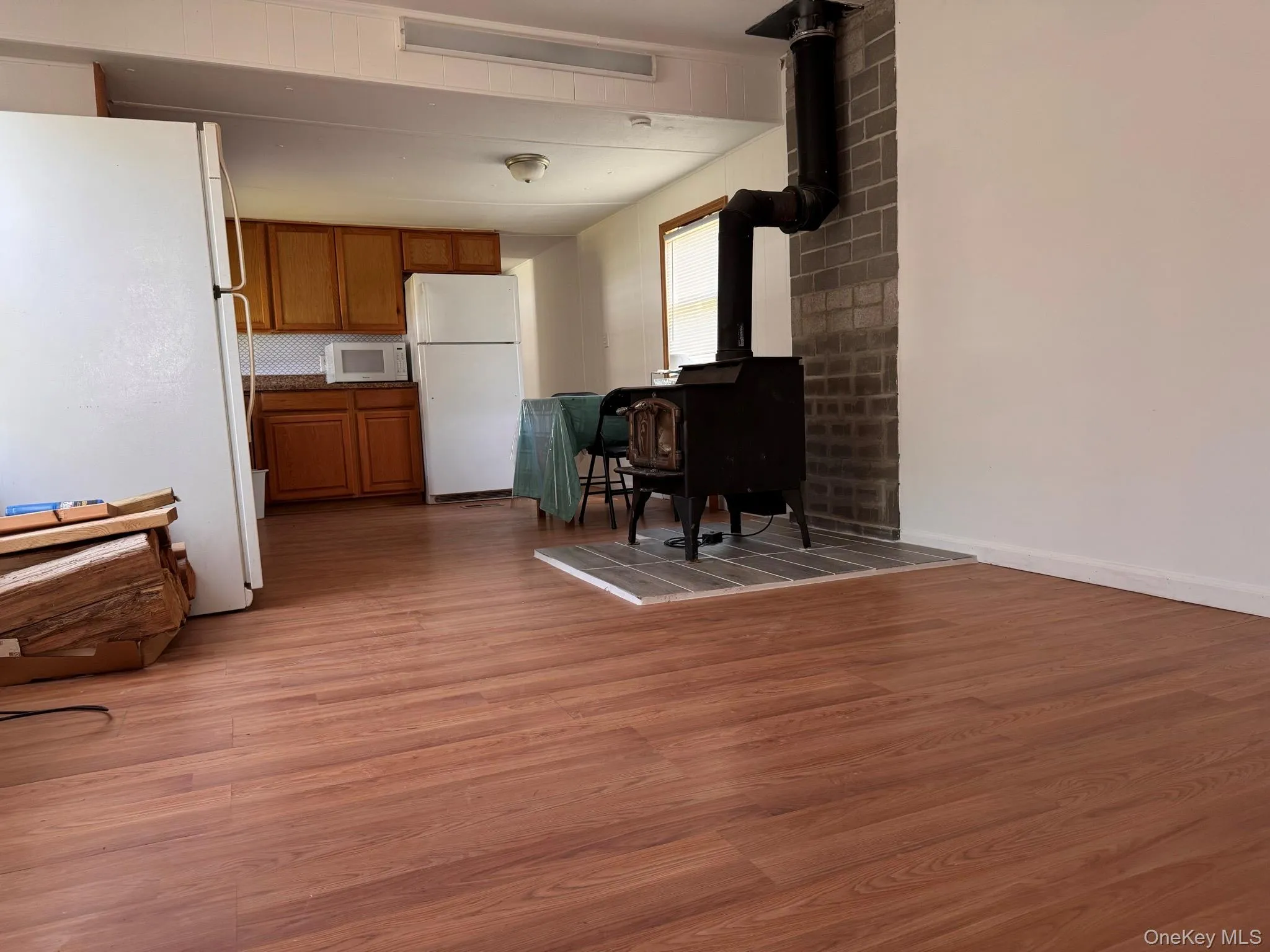Open concept interior featuring wood-finish flooring Open concept interior featuring wood-finish flooring