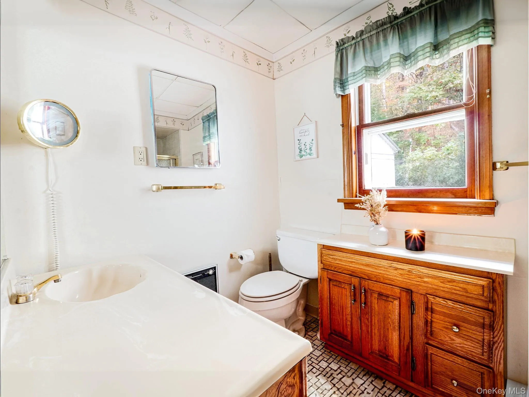 Bathroom featuring toilet and vanity Bathroom featuring toilet and vanity