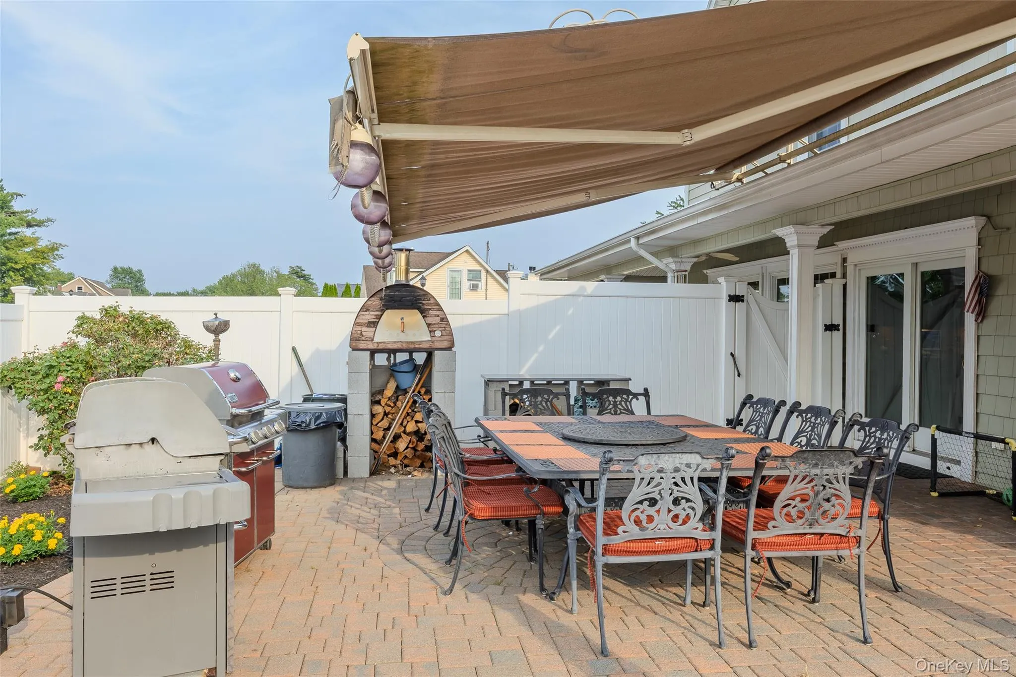 Fenced backyard with outdoor dining area, a patio area, and a grill Fenced backyard with outdoor dining area, a patio area, and a grill