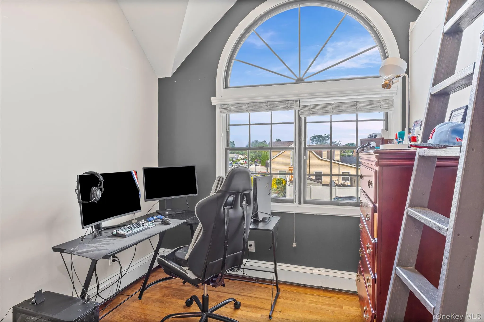 Office space with light wood-style floors, healthy amount of natural light, and lofted ceiling Office space with light wood-style floors, healthy amount of natural light, and lofted ceiling