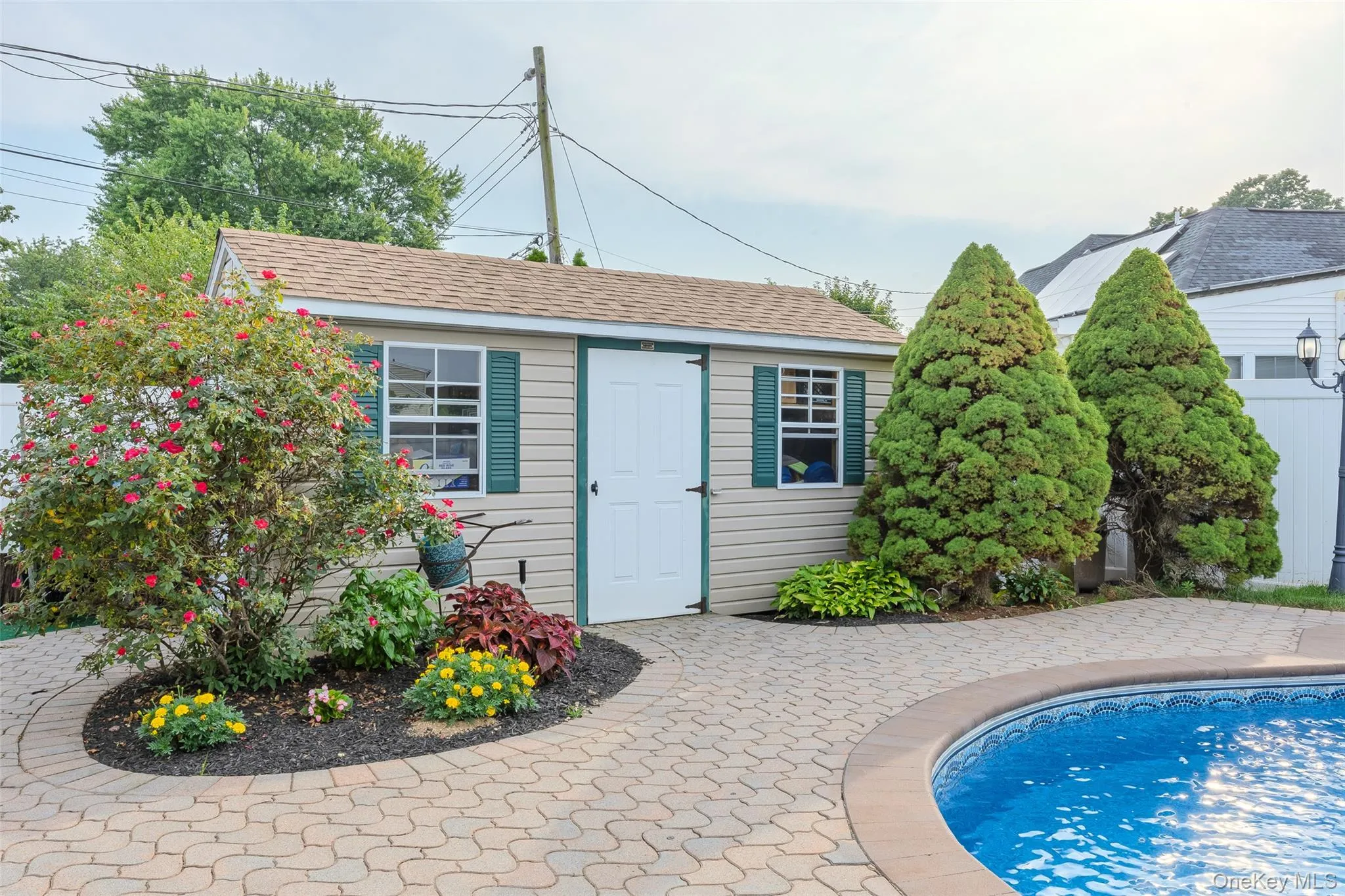 View of outdoor structure with an outdoor pool View of outdoor structure with an outdoor pool