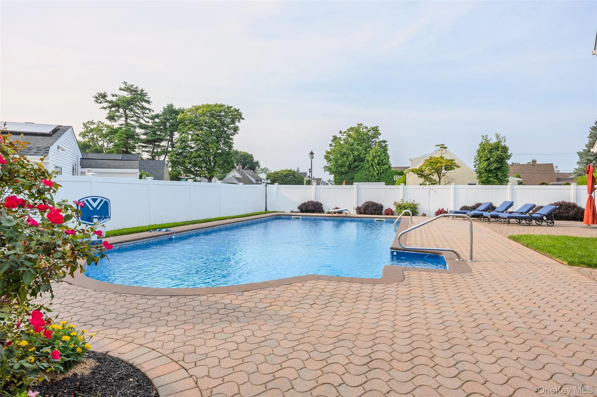 View of swimming pool with a fenced backyard and a patio area View of swimming pool with a fenced backyard and a patio area