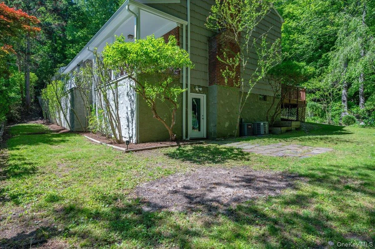 Side view of the house, showing basement door. Side view of the house, showing basement door.