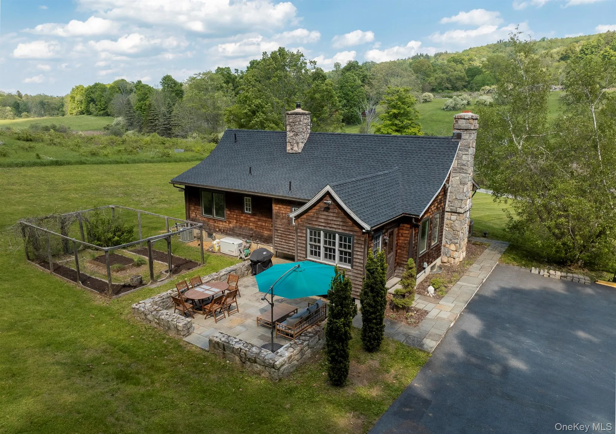 Back Stone Terrace with seating and dining area. Garden. Back Stone Terrace with seating and dining area. Garden.