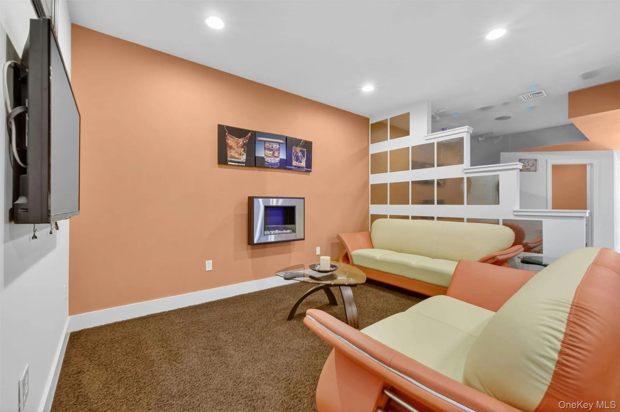 Chic lounge with ethanol fireplace, custom lighting, and designer seating. Chic lounge with ethanol fireplace, custom lighting, and designer seating.